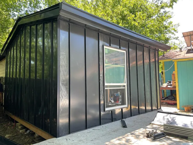 Black standing seam metal wall panels for Metal Roof Installation in Boston