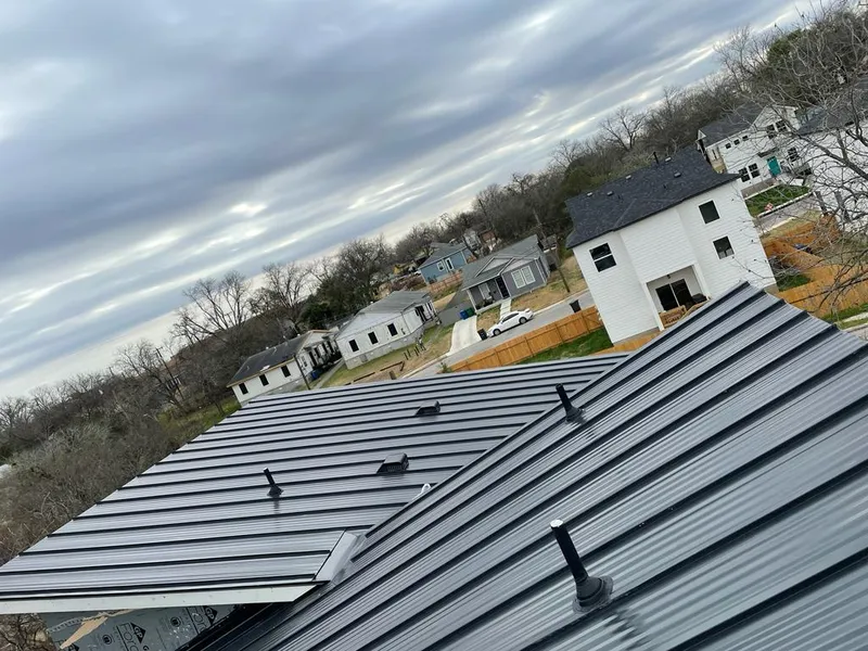 Standing seam metal roof panels with vents for Skylight Repair in Boston